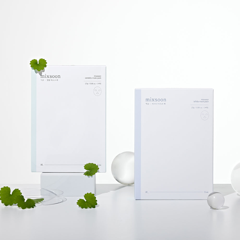 Mixsoon Bifida and Centella mask boxes displayed with sachets and green leaves