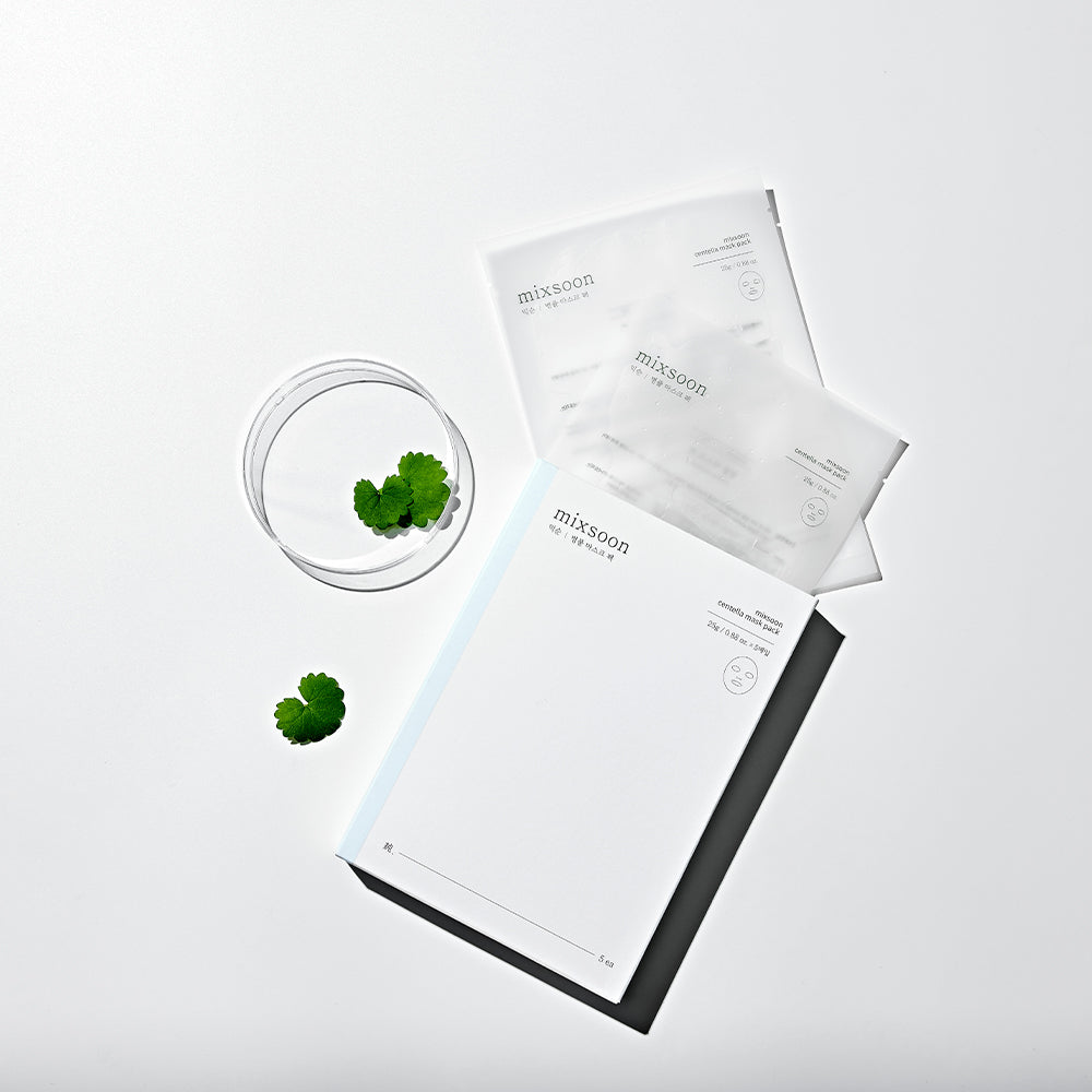 Mixsoon Centella Mask Pack box and sachets arranged with leaves and a glass bowl
