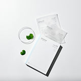 Mixsoon Centella Mask Pack box and sachets arranged with leaves and a glass bowl
