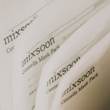 Close-up of the Mixsoon Centella Mask Pack branding on stacked packaging