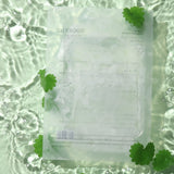 Mixsoon Centella Mask Pack sachet in water with green leaves